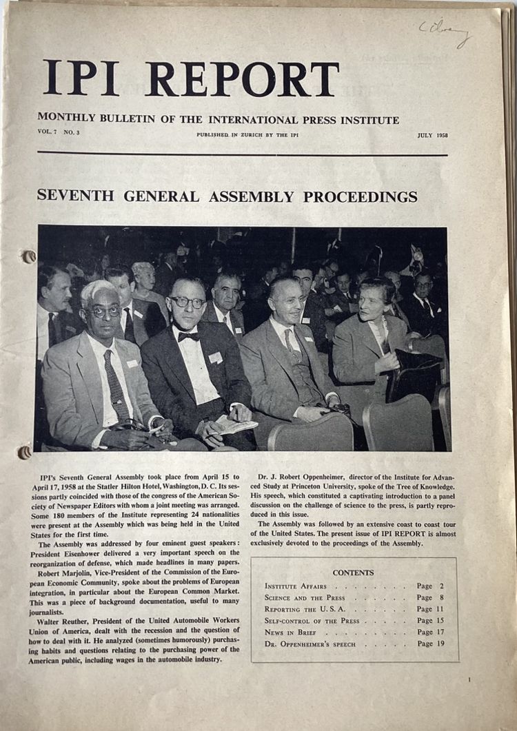 Photo of three men and one woman in smart suits